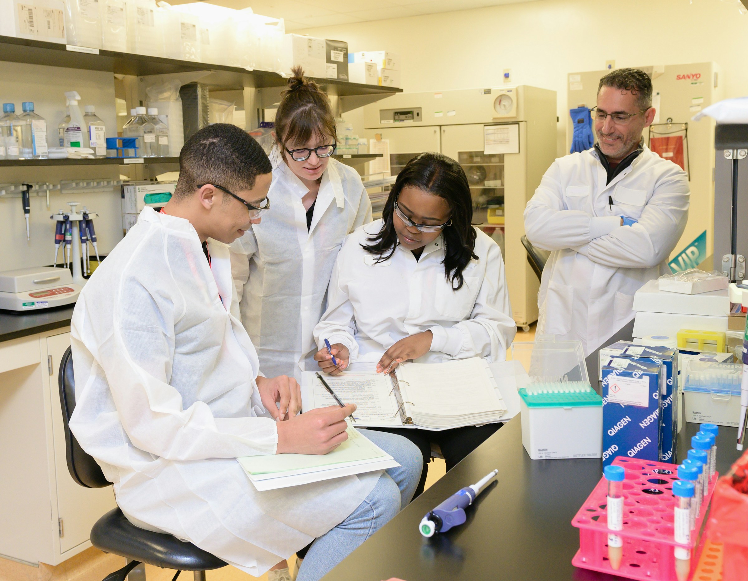 A bright, modern analytical laboratory with automated instruments
