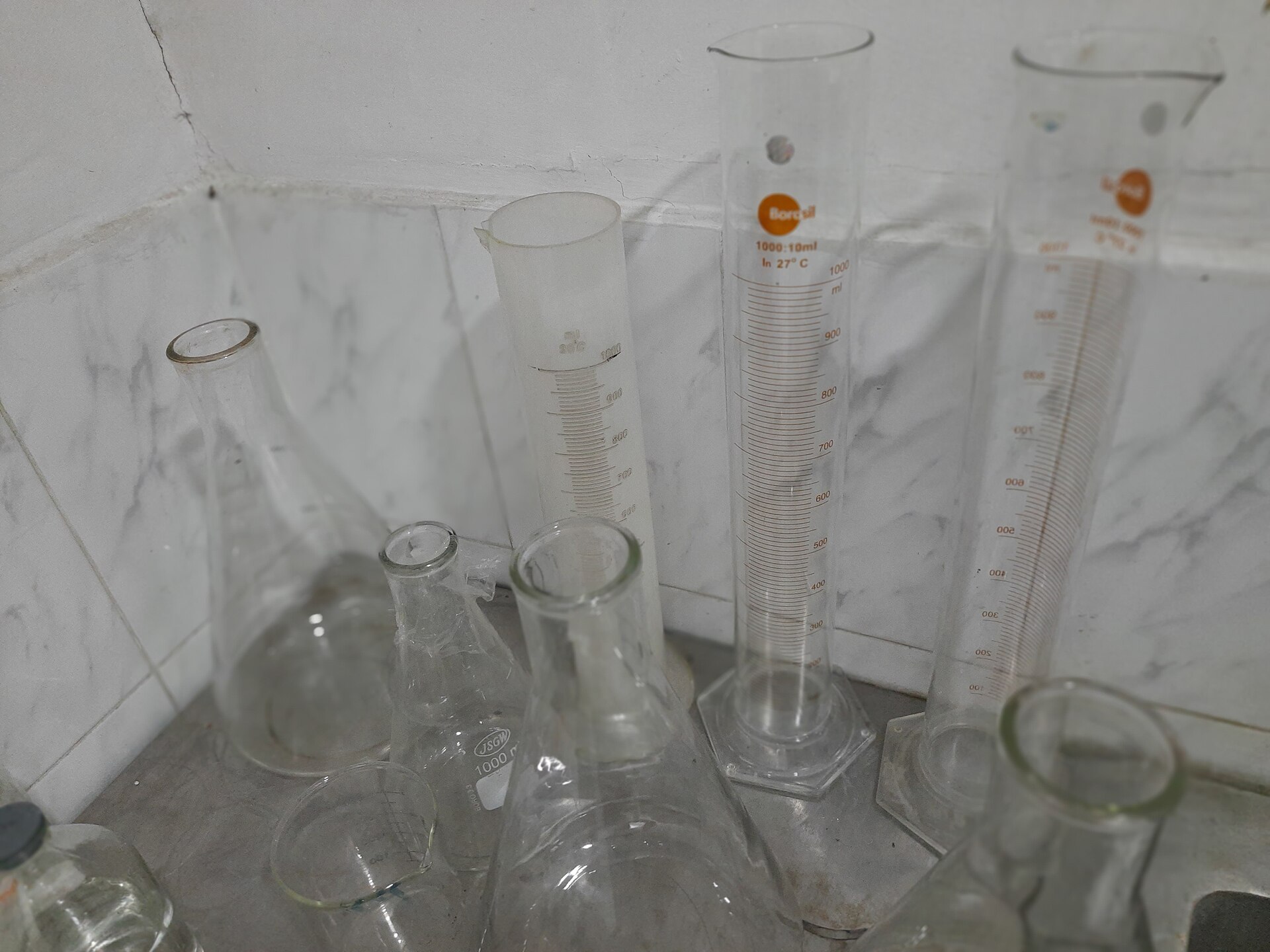 Researchers reviewing a documentation binder at a laboratory bench